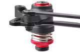 Close-up of a black and red mechanical component featuring a metal spring labeled Team Corally C-00180-216 Servo Saver Spring, designed for radio control parts in rc cars.