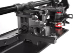 Close-up of the Team Corally COR00180-605 Aluminum Motor Bulkhead V2 mounted on a radio control car chassis, highlighting its sturdy aluminum construction and precise design.