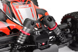 Close-up of black and red Team Corally C-00180-658 Shock Cap Protector (2) installed on the shock absorbers of a radio control car, highlighting the durable metal components.