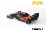 Team Saxo TS01945 1/10 F1 Body Shell (Clear) painted in black and orange with detailed decals, designed for radio control car customization and upgrades.