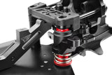 Close-up view of the Team Corally C-00180-266 Aluminum Servo Saver Steering Arm installed on an RC car chassis, featuring detailed metal and plastic components.