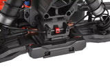 Close-up view of a black rear suspension arm mount on a radio control car featuring the Team Corally C-00180-979 Rear Suspension Arm Mount Covers Set XB G2, highlighting detailed suspension components.
