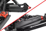 Close-up view of black Team Corally C-00180-1066 Mud Guards HDA-4 Left + Right Pair installed on RC car suspension components with red anodized aluminum accents.
