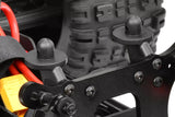 Close-up of black plastic radio control car part mounted on chassis, showing details of Team Corally C-00180-106 Front Body Post (2) for rc car assembly.