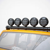 Gmade GM40054 LED Light Bar Set (5 Lights) Buckets mounted on the roof of an orange radio control car, designed as realistic rc car parts for enhanced off-road styling.