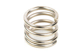 Close-up of a metal coil spring designed for radio control parts, specifically the Team Corally C-00180-216 Servo Saver Spring used in rc cars.