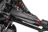 Close-up of Team Corally C-00180-530 Upper Front Suspension Arm HDA-4 installed on an RC car, showing black and red detailed components of the suspension system.