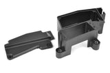 Black plastic radio control car part shown disassembled, identified as Team Corally C-00180-997 Servo Mount / Receiver Box M23, designed for secure mounting and protection in RC cars.
