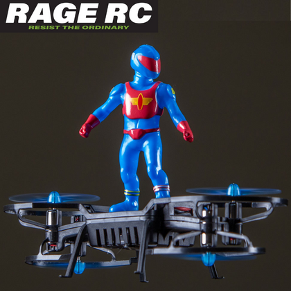 Small blue and red action figure standing on a black quadcopter drone with blue propellers, showcasing the Rage RC AeroBoard RTF Patriot Mini Indoor Drone in mid-flight against a dark background.
