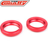 Two red anodized aluminum shock collars designed for RC cars, labeled as Team Corally C-00180-136 Aluminum Shock Collar (2) with fine grooves for secure fitting.