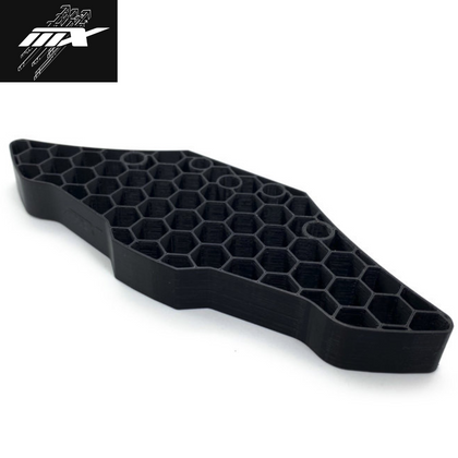 Black honeycomb-structured radio control car part designed for durability and impact absorption, identified as MXLR MAX-09-008 FlexBumper XPRESS AT1 / XQ2S / XQ10.