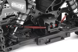 Close-up view of the Team Corally C-00180-201 Anti-Roll Bar 2.6mm Rear installed on an RC car chassis showing detailed suspension and radio control parts.
