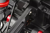 Close-up view of a black suspension arm with metal pivot components on an rc car, featuring Team Corally C-00180-170 6.8mm Steel Ball (2) used as part of radio control parts for enhanced performance.