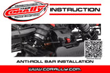 Close-up of a black suspension system on an RC car featuring the Team Corally C-00180-201 Anti-Roll Bar 2.6mm Rear with visible springs and mounting components.