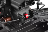 Close-up of a Team Corally C-00180-231 Aluminum Collar for Anti-roll Bar (2) installed on an rc car chassis, showing the red aluminum collar securing the anti-roll bar.