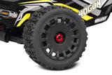 Close-up of a rugged off-road tire mounted on a black and yellow radio control vehicle, featuring Team Corally Tracer Off-Road 1/8 Truggy Tires Mounted (2).