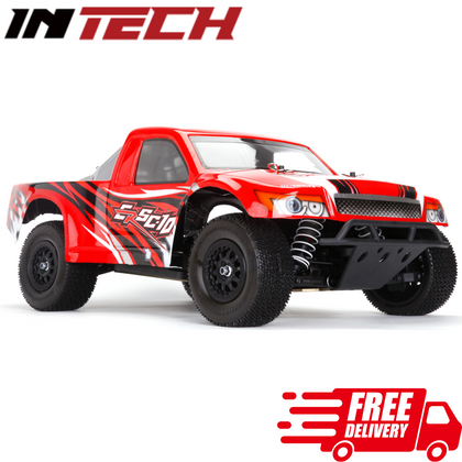 Red and black INTECH ERSC-10 1/10 4wd Short Course Truck Kit with rugged tires and suspension, designed for off-road radio control enthusiasts.
